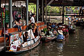 Thailand, Locals sell fruits, food and products at Damnoen Saduak floating market near Bangkok 